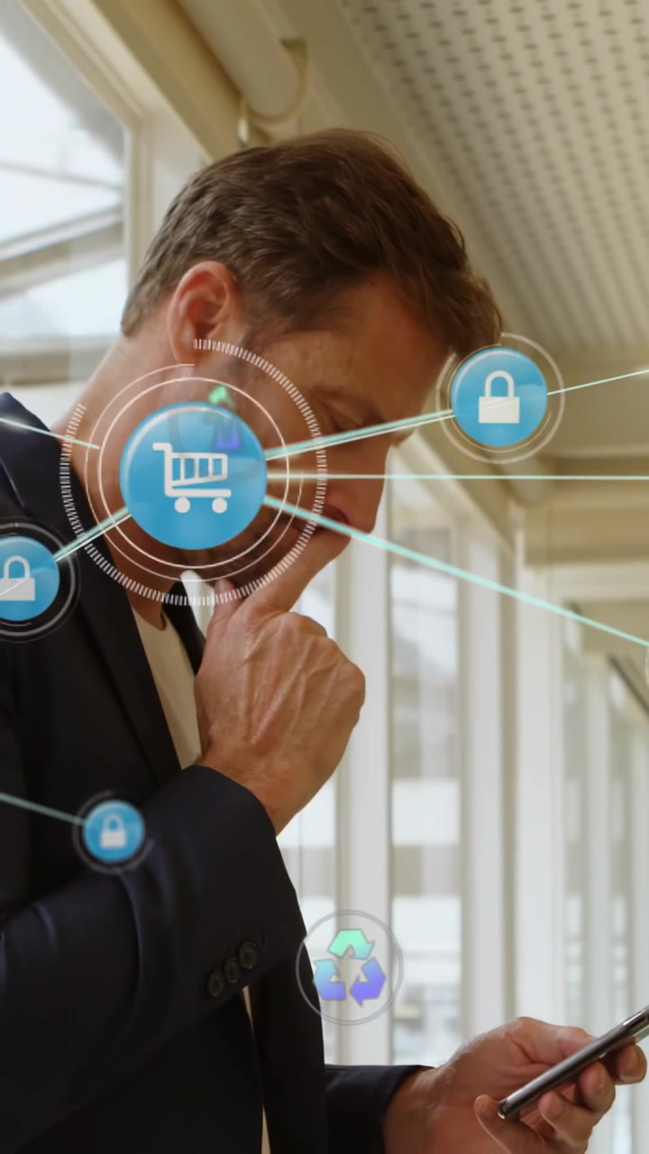 Video verticale: Uomo che tocca il telefono in un atrio di vetro, generando icone ESG animate che monitorano le metriche.