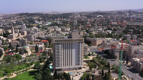 aerial view of jerusalem cityscape with a large hotel and park
