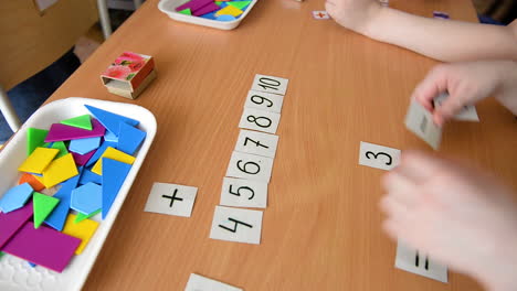 children learning addition and shapes