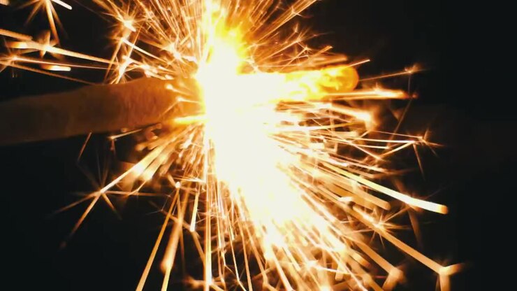 Close up shot of Sparkler getting ignited on Diwali in India