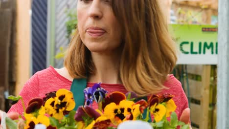 Female-florist-checking-flowers