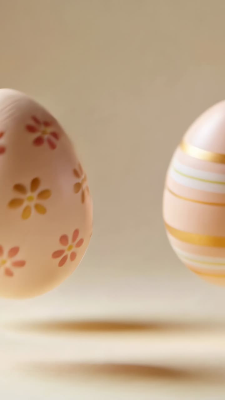 Vertical video: Rolling floral egg from tap, tilting, showing blooms on beige mat, with striped-egg