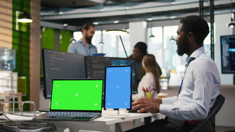 startup office admin reviewing ai system metrics on isolated screen devices