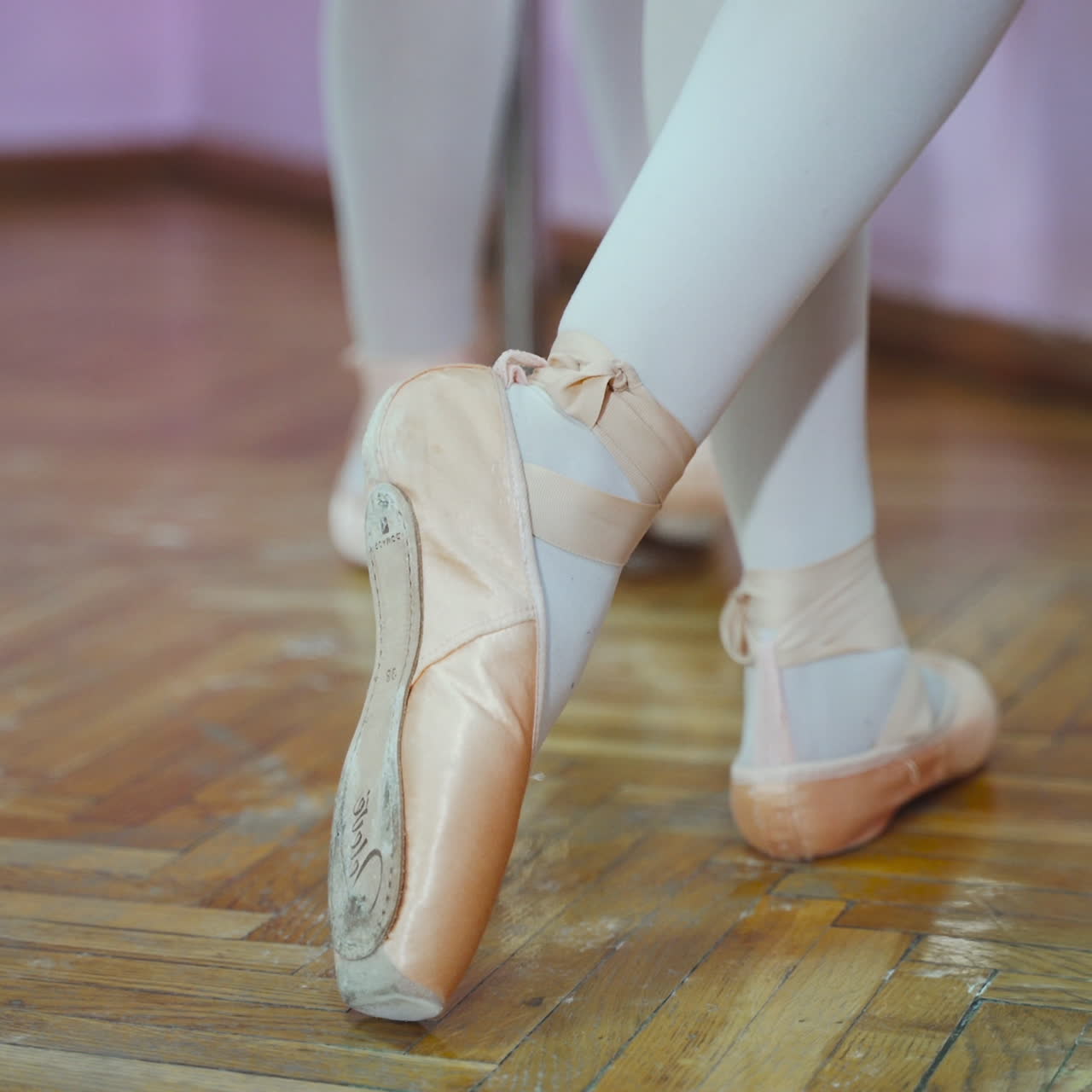 Ballet. Close-up of ballerina feet in pointe shoes. Woman's feet in pointe shoes.