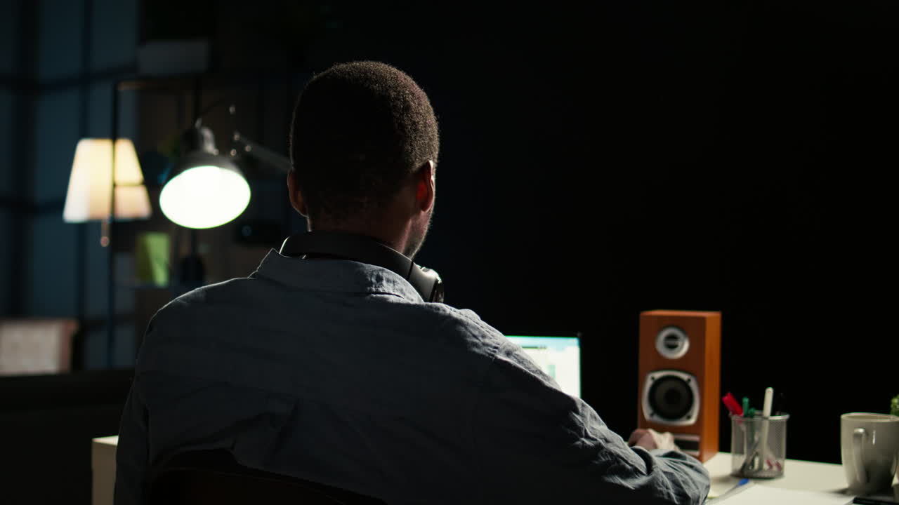 African american analyst works on accounting analysis while he is dancing