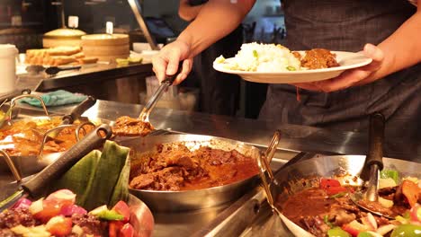 chef serving food at a market stall