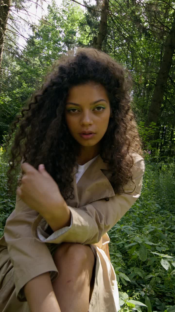 Woman with Curly Hair in Forest