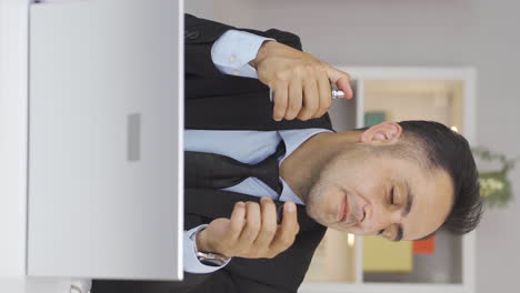 Vertical-video-of-Home-office-worker-sprays-perfume-on-man.