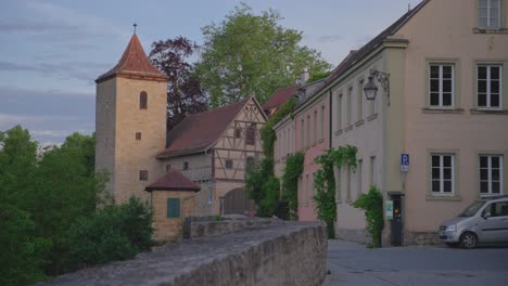 traditional german architecture in the medieval town of rothenburg ob der tauber, bavaria, at sunset, featuring the furbringer barn and its tower