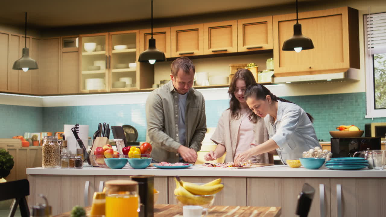 Family preparing homemade pizza together by adding fresh ingredients