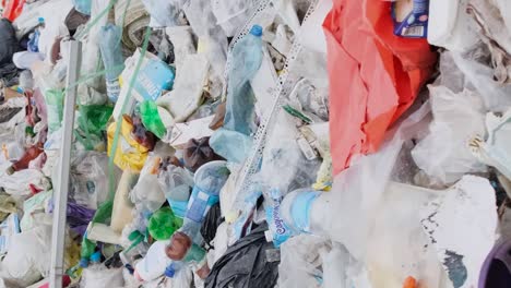 plastic garbage on the shore plastic garbage on the shore a view of plastic bottle washed by sea waves a concept of plastic garbage contribute to ocean pollution