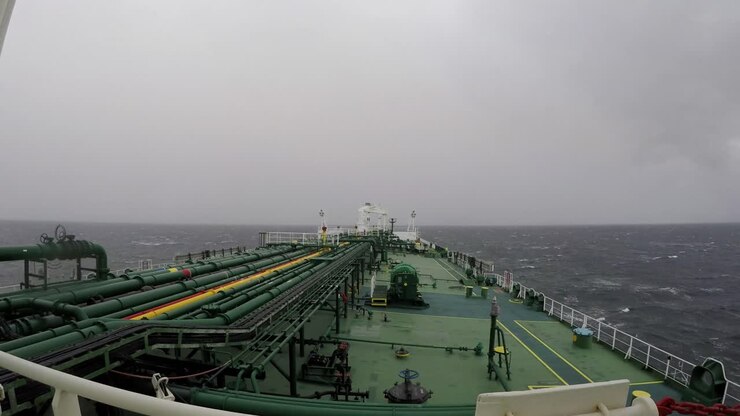 Time lapse oil tanker transit crossing Strait of Magellan Punta arenas sunny rain