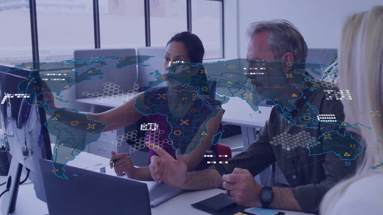 office team pointing at monitor and nodding sparking digital map scaling nodes for analysis