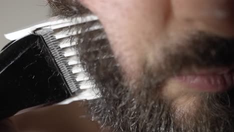 detailed slow-mo beard trim with electric clipper