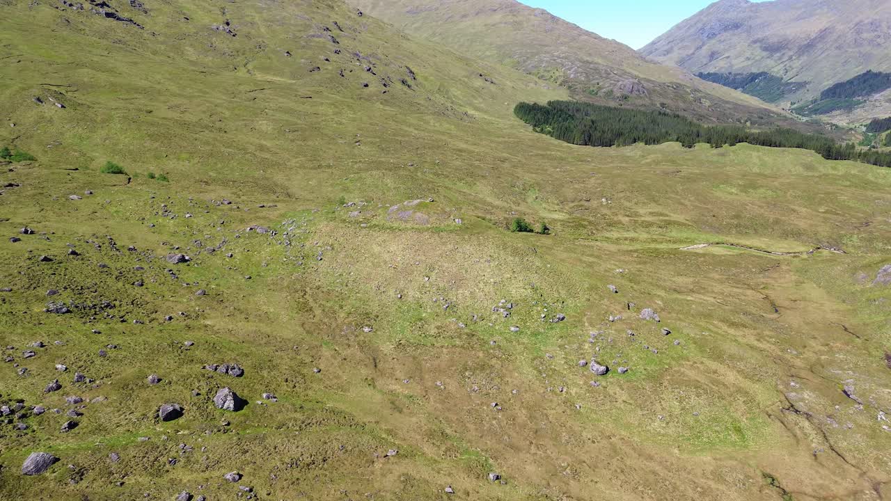 Flying over the landscape in the Highlands of Scotland, UK