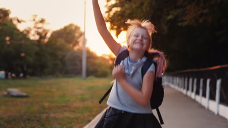 Cheerful-Niño-With-A-Satchel-Behind-His-Back-Runs-Towards-The-Camera-Back-To-School