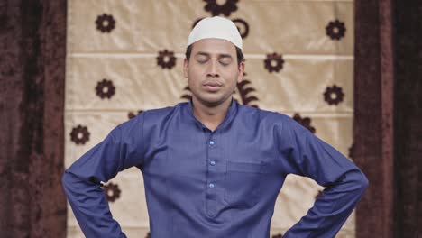 indian muslim man relaxing and taking long breaths