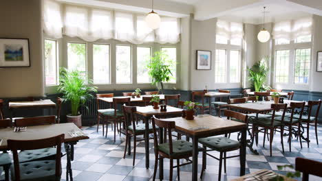 Empty-Restaurant-Interior-With-Tables-Set-For-Service