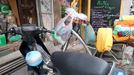 motorbike and goods on a busy street