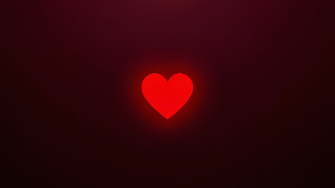 Clip iniziale che mostra un cuore rosso pulsante che si illumina su un gradiente marrone scuro, evidenziando il cuore