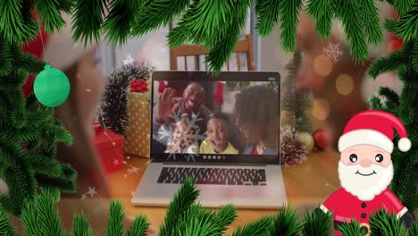 animación de decoraciones de navidad sobre una familia afroamericana que tiene una videollamada por computadora portátil