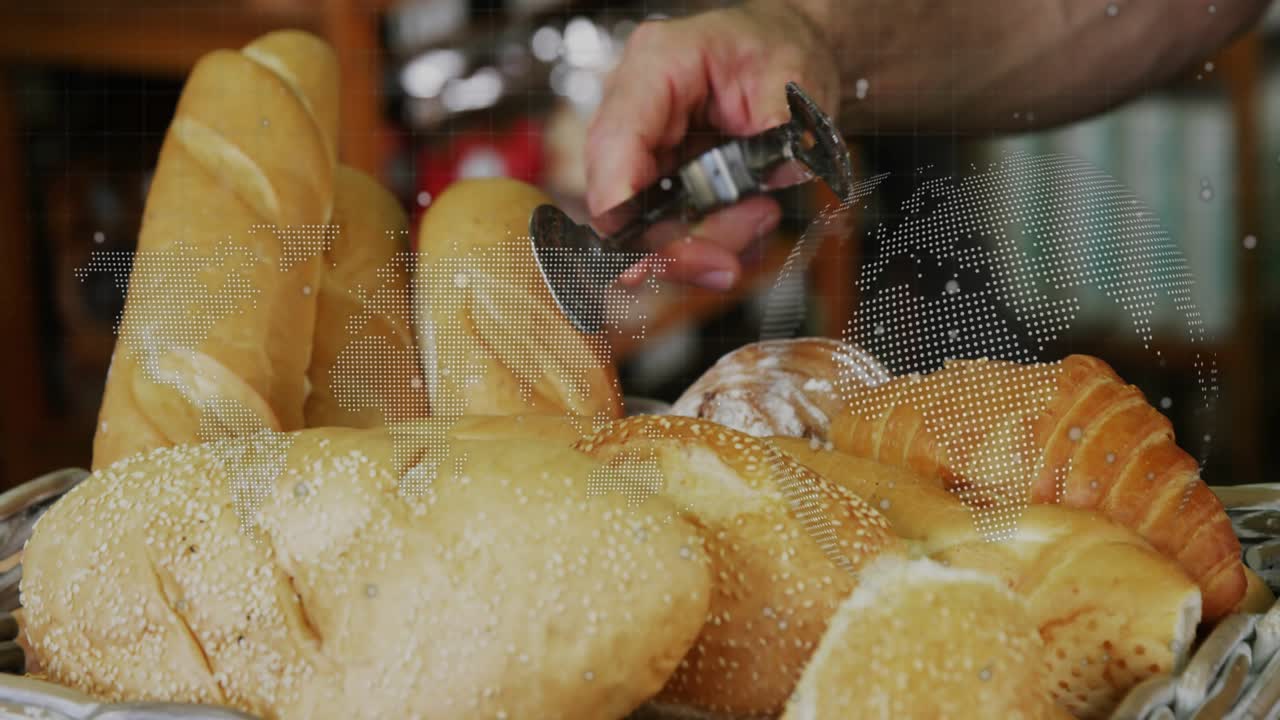 Baker wearing striped apron picking croissant-like roll with metal tongs per customer request