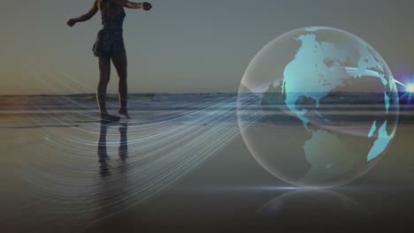 animation of glowing global network over woman walking on sandy beach