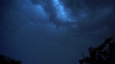 Dark storm clouds before rain. Light in the dark and dramatic storm clouds background