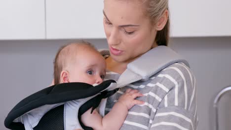 mother carrying her baby