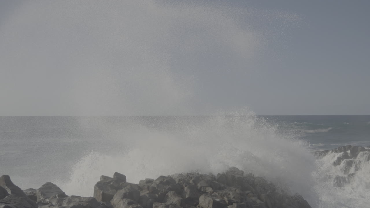 Powerful Waves Crashing on Rocky Coastline
