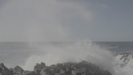 powerful waves crashing on rocky coastline