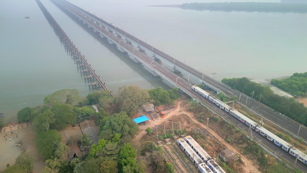 2 trains coming from naigoan to bhayandar on vasai creek bridge bird eye view