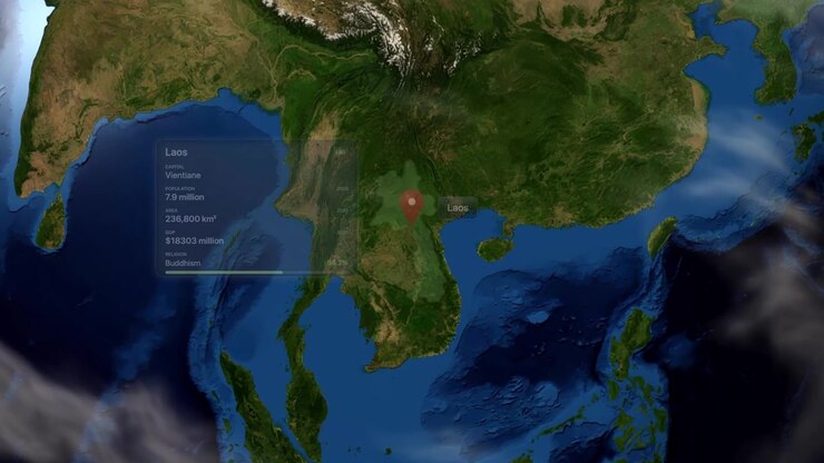 Satellite view zooms from outer space into Laos with highlighted borders and infographic data overlay. Includes NASA public domain imagery.