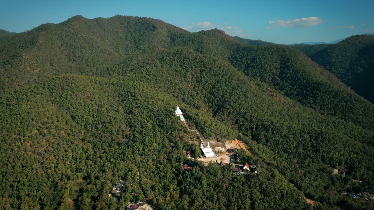 Aerial Scenic Drone Footage of the Big White Buddha in the Mountains of Pai, Thailand on a Sunny Day