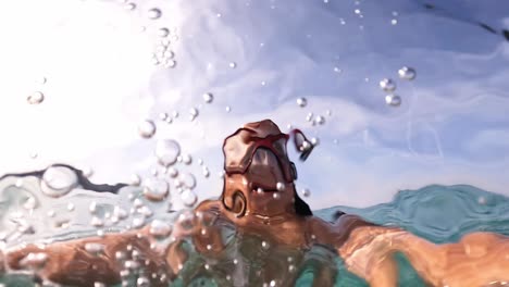 Underwater-selfie-of-little-redhead-girl-with-diving-mask-holding-camera-while-swimming-in-crystal-clear-turquoise-sea-water