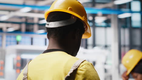 photovoltaics factory worker uses tablet to improve solar panels manufacturing