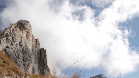 paragliding in the dolomite mountains with clouds