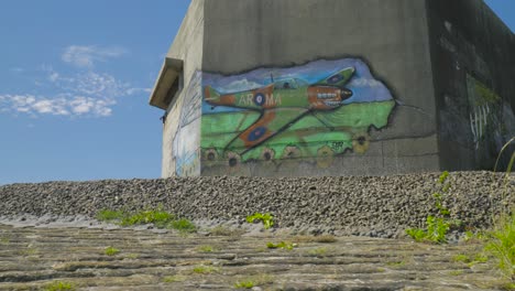 spray-painted graffiti art of an aircraft on beacon hill fort building exterior in harwich, essex, uk