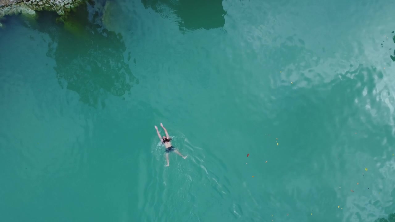 Swimming in turquoise clear, where waters shine and doubts disappear