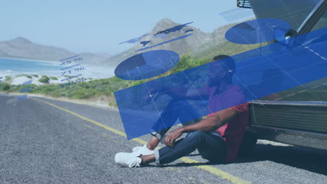 animación del procesamiento de datos financieros sobre un hombre afroamericano sentado en la carretera