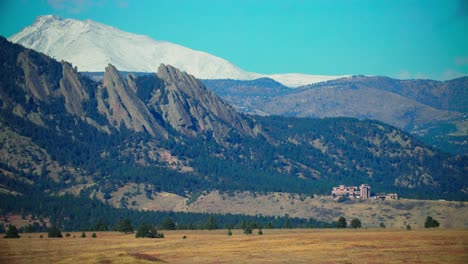 landscape view of flat irons in boulder colorado, fall season winter snow approaching