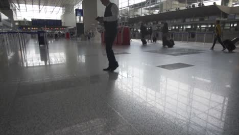 Busy-Airport-Main-Hall-with-Business-people-and-Suitcases