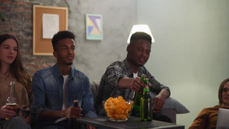 young african-american guys take beer watching baseball game