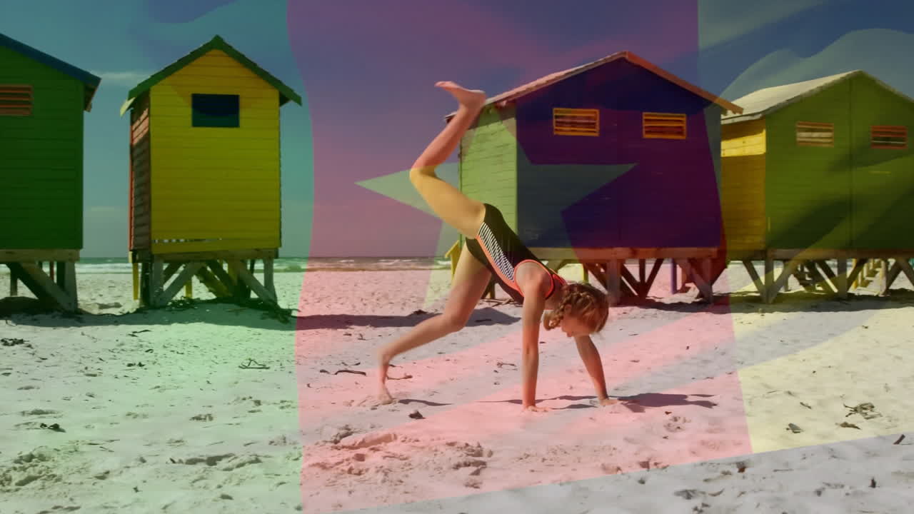 On beach, child doing cartwheel with colorful huts and animation flag overlay