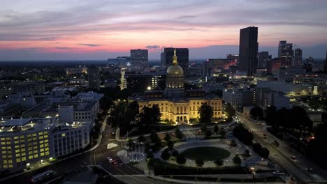 Georgia-state-capitol-building-in-Atlanta,-Georgia-at-night-with-drone-video-moving-left-to-right