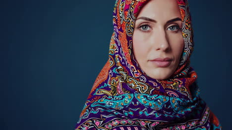 close-up portrait of a woman wearing a colorful hijab