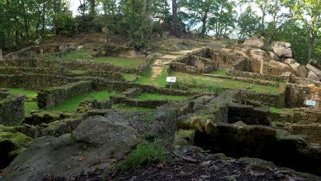 stone ruins at castro cibdá de armeá archaeological complex, surrounded by trees, ourense, galicia