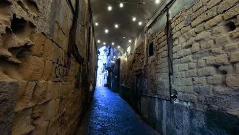 people interacting in a decorated alleyway