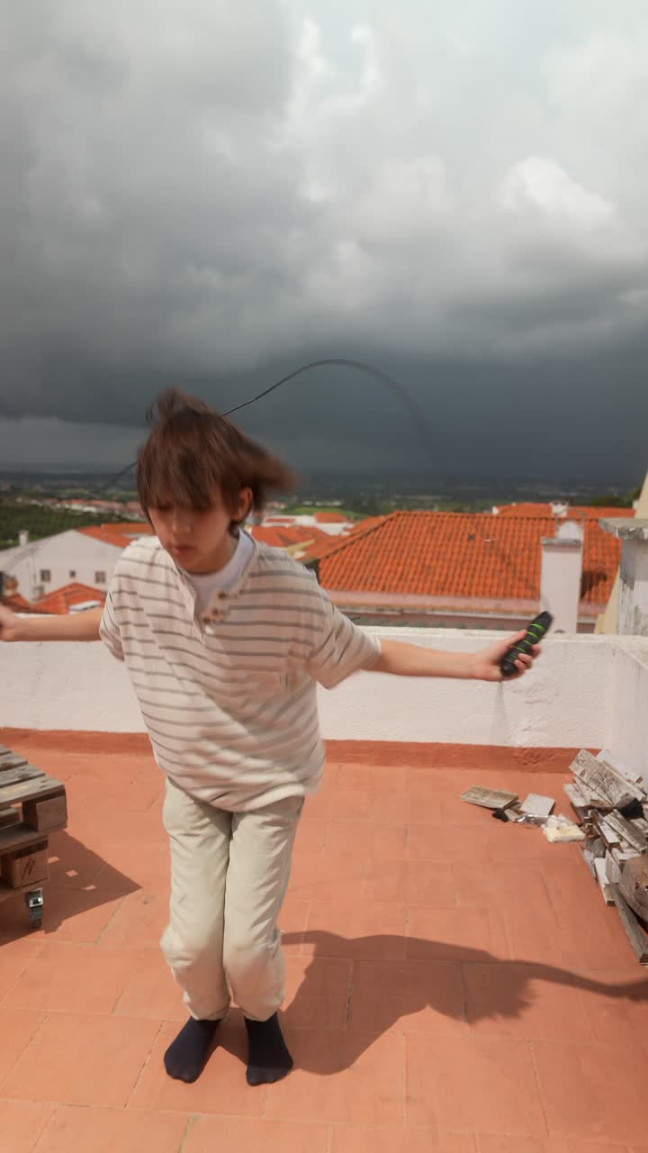 Child Jumping Rope on Rooftop on a Cloudy Day