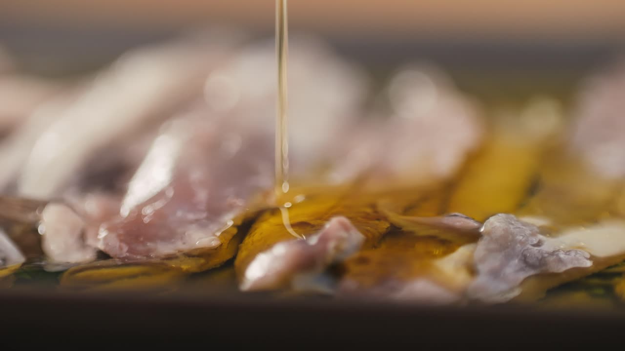 Fresh Sea sardines and Anchovy Fish and Mullus On Display On Ice On Market Store Shop. Seafood Fish Background, close up stand of small salty white fish.